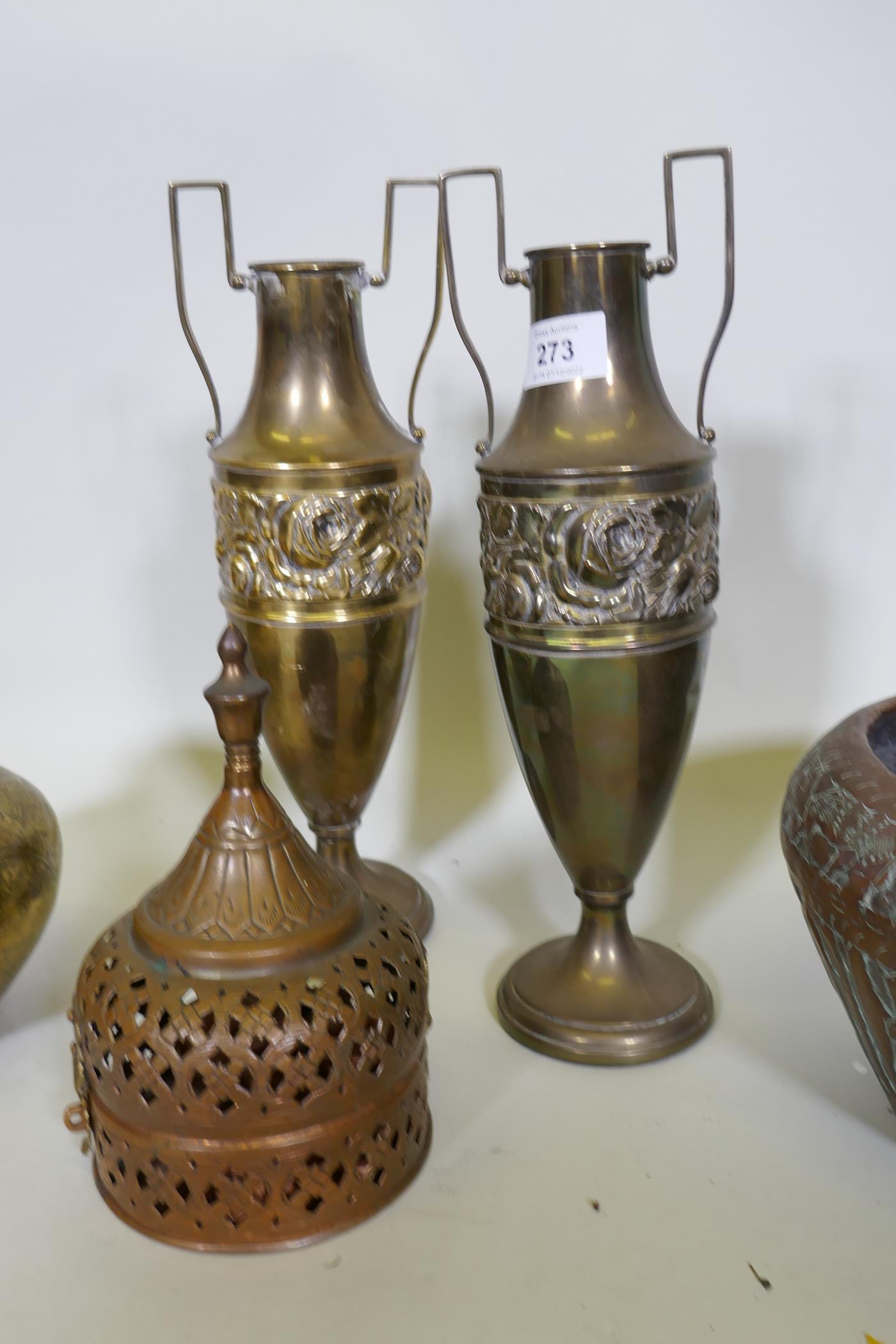 An Indian brass pot with engraved decoration, a copper jardiniere, a pair of brass urns, 33cm high - Bild 2 aus 3