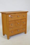 A contemporary oak three drawer chest, the drawers fitted with dividers, 66 x 66 x 35cm