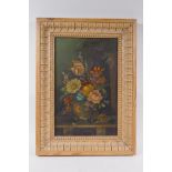 A C19th still life of flowers, oil on board, housed in an C18th carved pine frame, 22 x 34cm