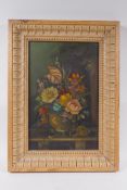 A C19th still life of flowers, oil on board, housed in an C18th carved pine frame, 22 x 34cm