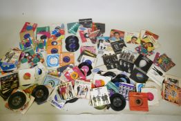 A collection of 60s and 70s 7" singles including The Beatles, Rolling Stones, The Shadows, Simon and