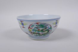 A doucai porcelain rice bowl with dragon decoration, Chinese YongZheng 6 character mark to base,