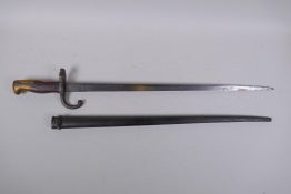 A late C19th French model 1876 bayonet, manufactured in Chatellerault, inscription to the blade, the