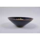 A Chinese Cizhou kiln conical bowl with dragon decoration, 15cm diameter