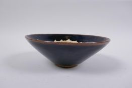A Chinese Cizhou kiln conical bowl with dragon decoration, 15cm diameter