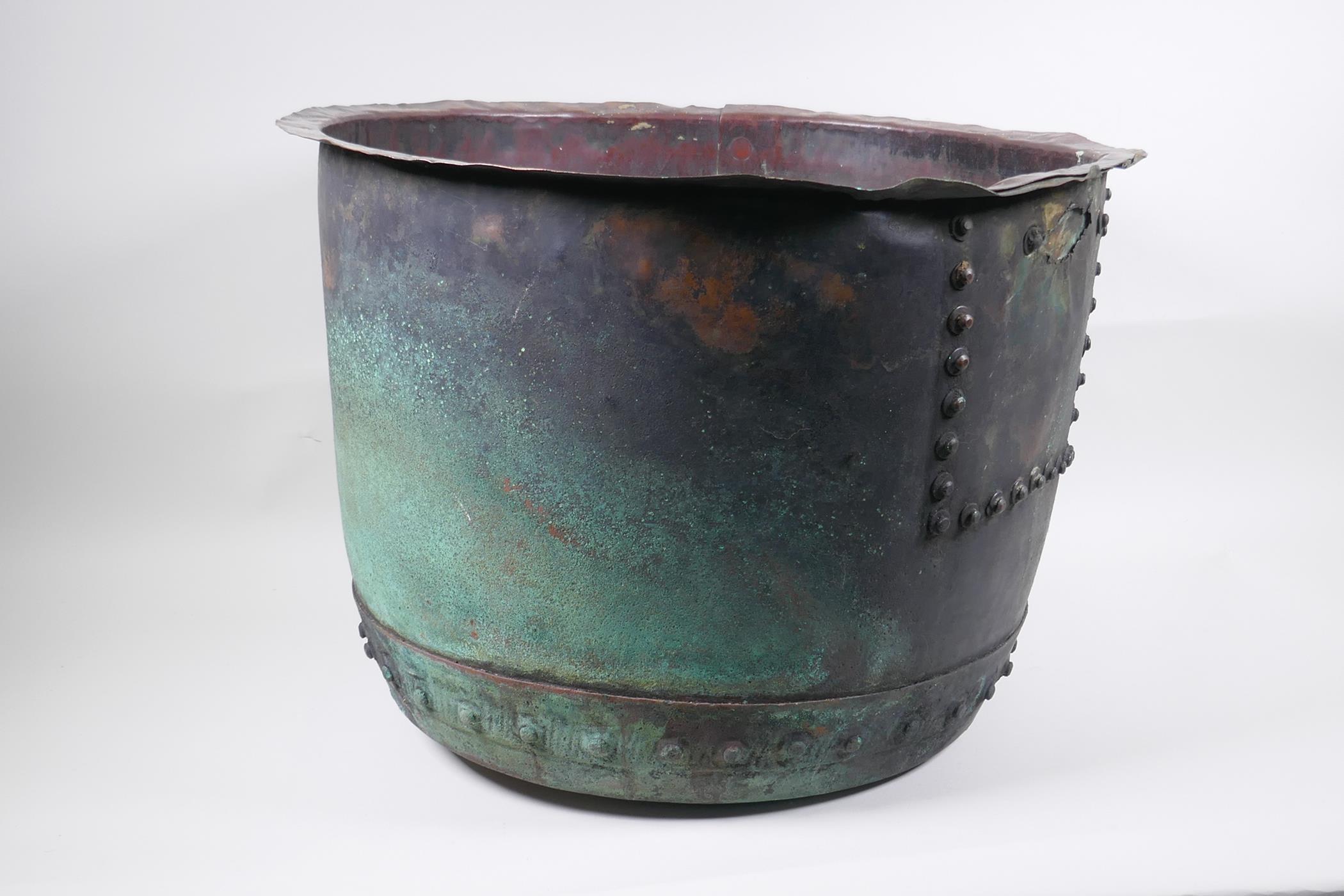 An antique riveted copper bin, with historic repair, 36cm high, 50cm diameter - Image 2 of 5