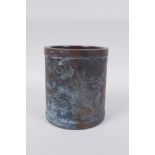 A Chinese bronze brush pot with engraved kylin decoration, impressed mark to base,