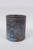 A Chinese bronze brush pot with engraved kylin decoration, impressed mark to base,