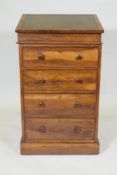 A Victorian rosewood davenport desk with leather inset all front and swivel top, with four drawers