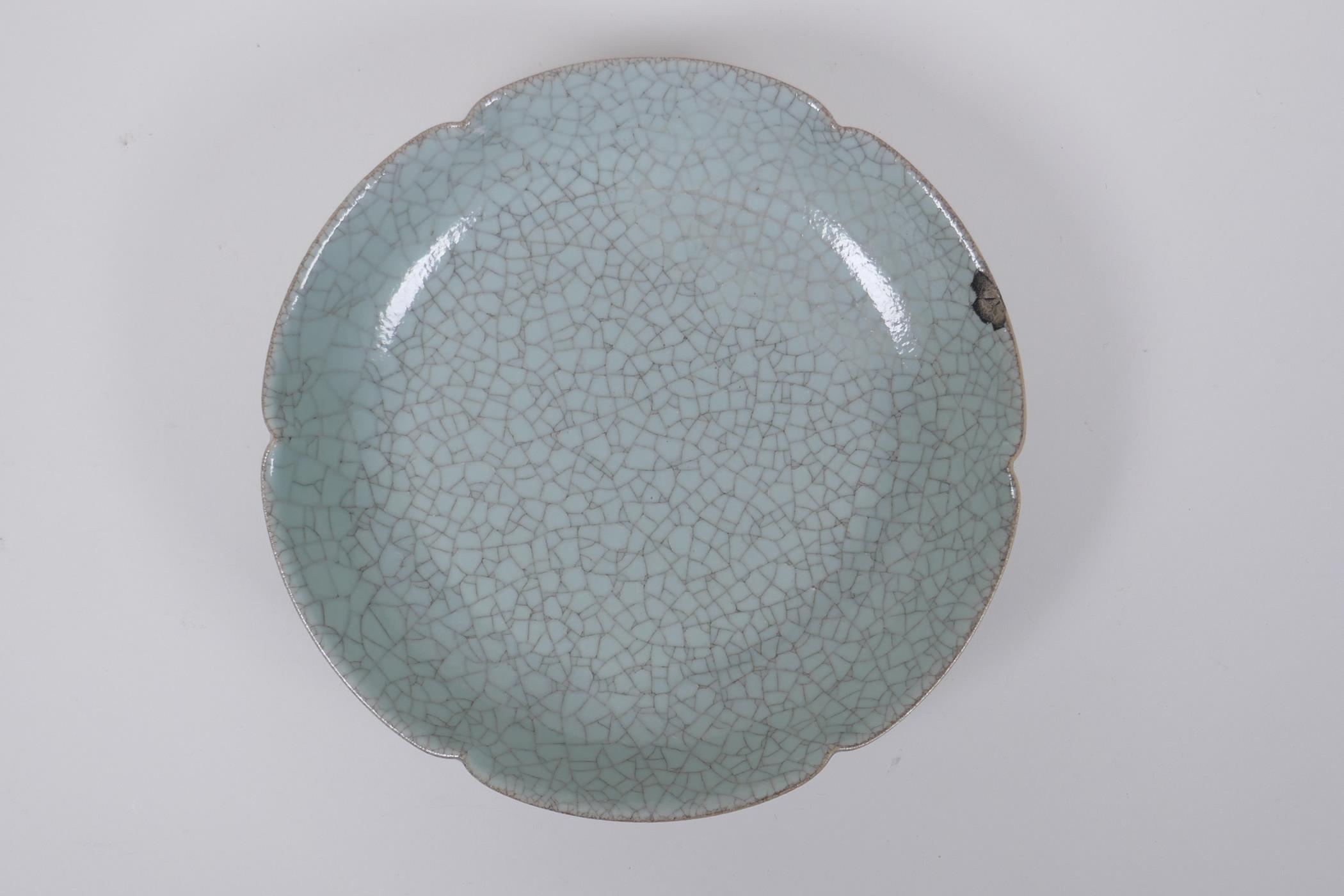 A Chinese celadon glazed porcelain dish with a petal shaped rim, AF, 19cm diameter - Image 2 of 4