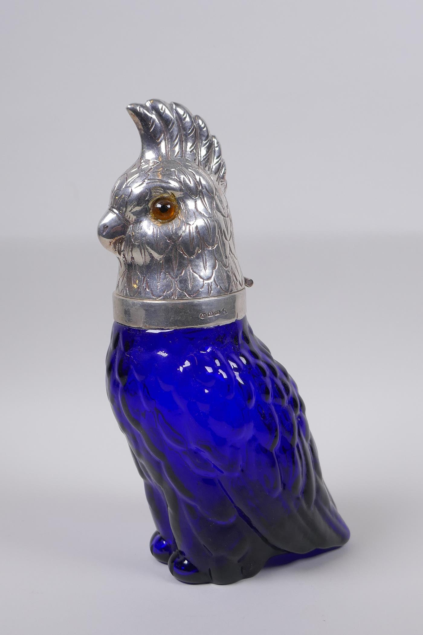 A blue glass and silver plated parrot shaped decanter, 24cm high, AF loose head