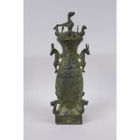 A Chinese archaic style bronze vase and cover with two kylin handles and decoration with mythical