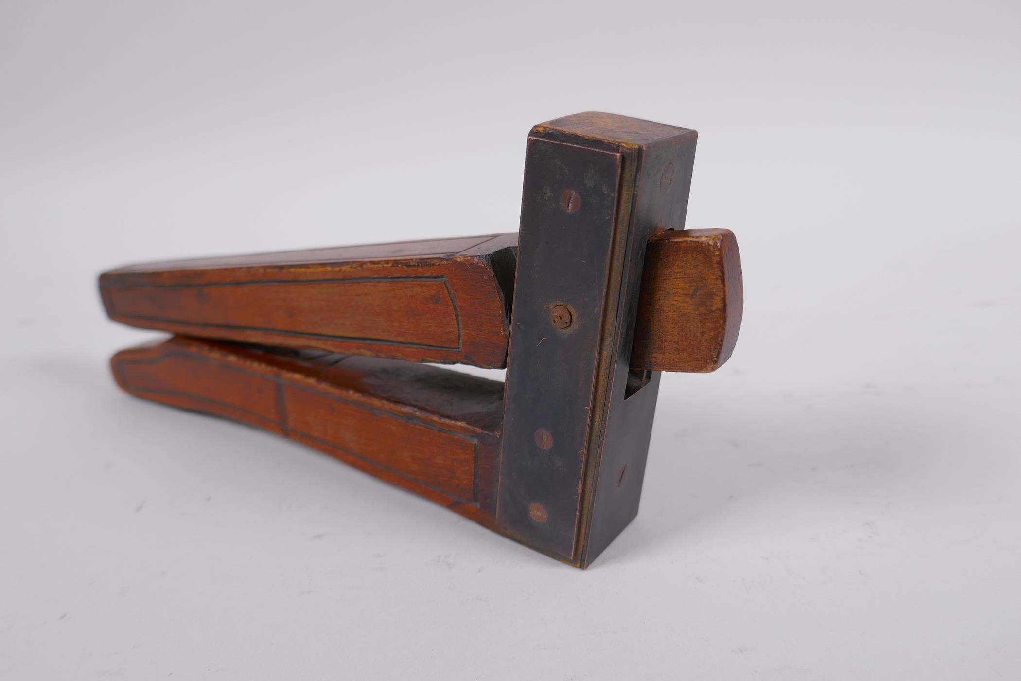 An antique walnut nut cracker with copper plates, inscribed, 19cm long - Image 5 of 5