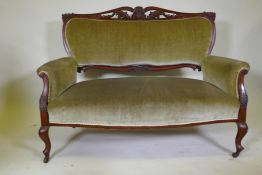 A C19th mahogany settee with carved and pierced detail and cabriole legs, possibly Berkey & Gay