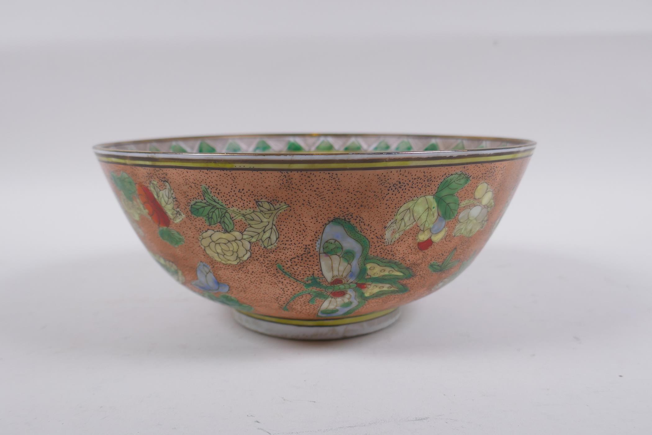 A Chinese peach ground porcelain bowl with famille verte enamel decoration of butterflies, flowers - Image 3 of 6