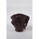 A Chinese bamboo libation cup with kylin decoration, impressed seal mark to base, 8cm high