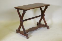 A C19th Anglo-Indian padouk wood stretcher table, raised on X shaped end supports united by a turned
