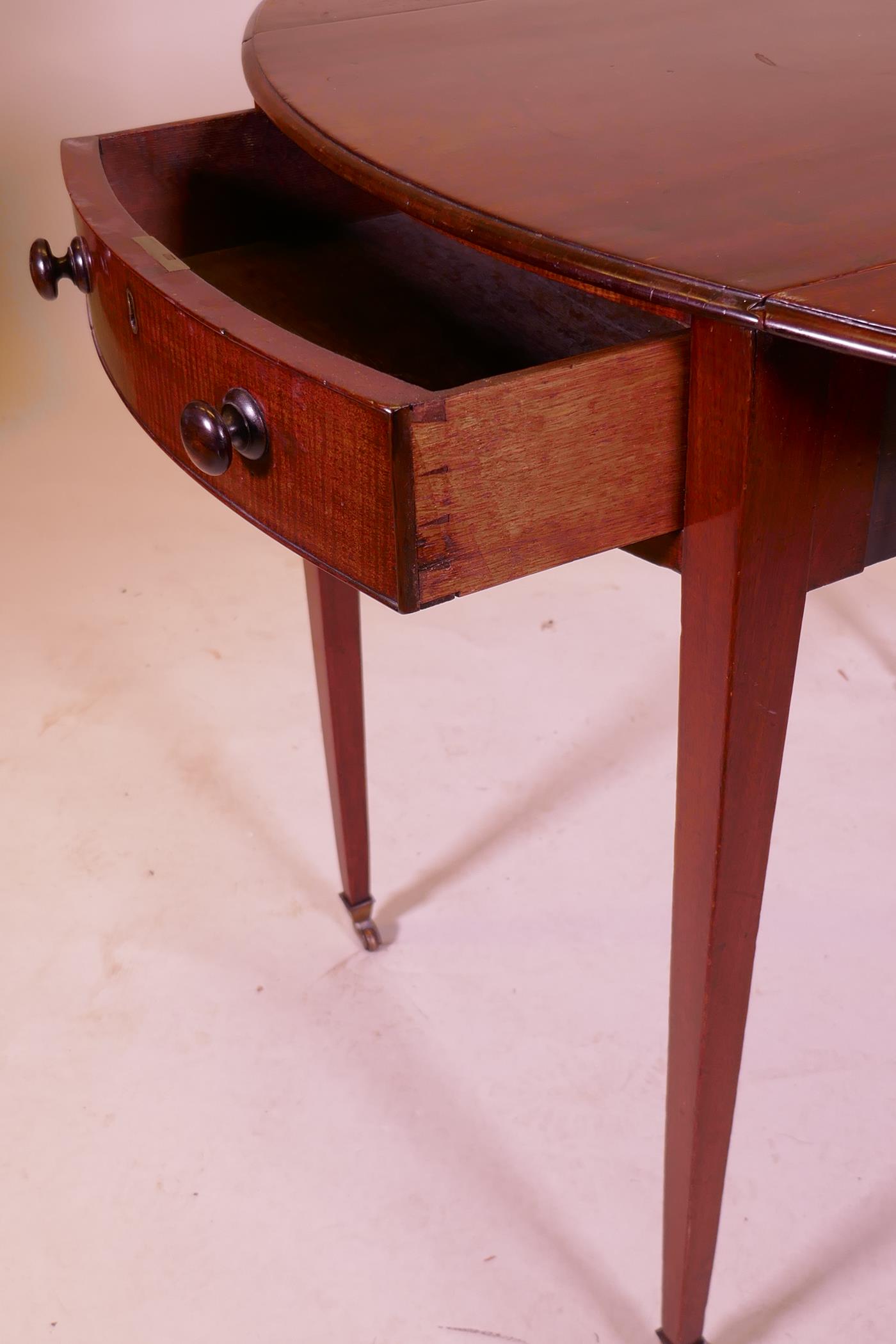 A George III mahogany Pembroke table with single drawer and bow ends, raised on square tapering - Image 6 of 7