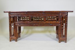 A vintage oriental bamboo low table with pine top and open lattice frieze, 108 x 27 x 51cm