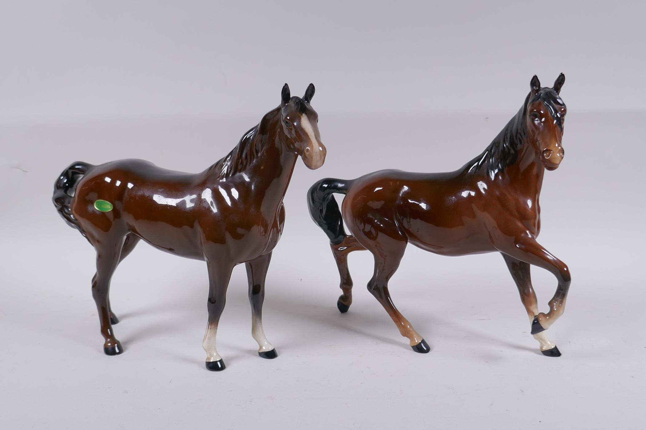 A Beswick horse and another similar Royal Doulton horse, 26cm long