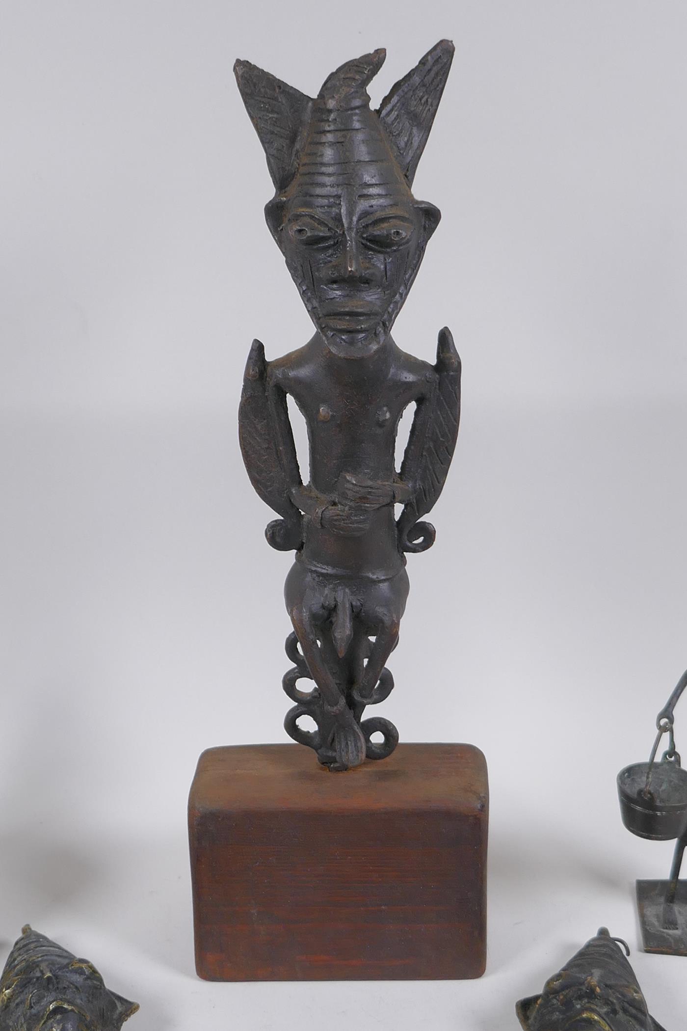 Three African benin bronze idols, one mounted, and two other benin bronzes of a water carrier and - Image 2 of 5