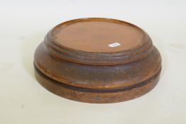 A C19th solid mahogany plinth/stand with dished top, 32cm diameter, 48 cm overall