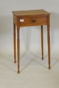 A late C18th/early C19th pine single drawer side table, raised on ring turned and splay tapering