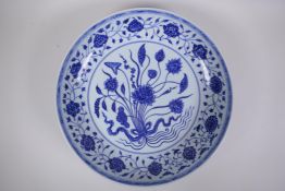 A blue and white porcelain charger with lotus flower decoration, Chinese Xuande 6 character mark