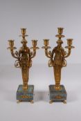 A pair of Ormolu three branch candelabra in the form of Greco Roman women, raised on vert de mer