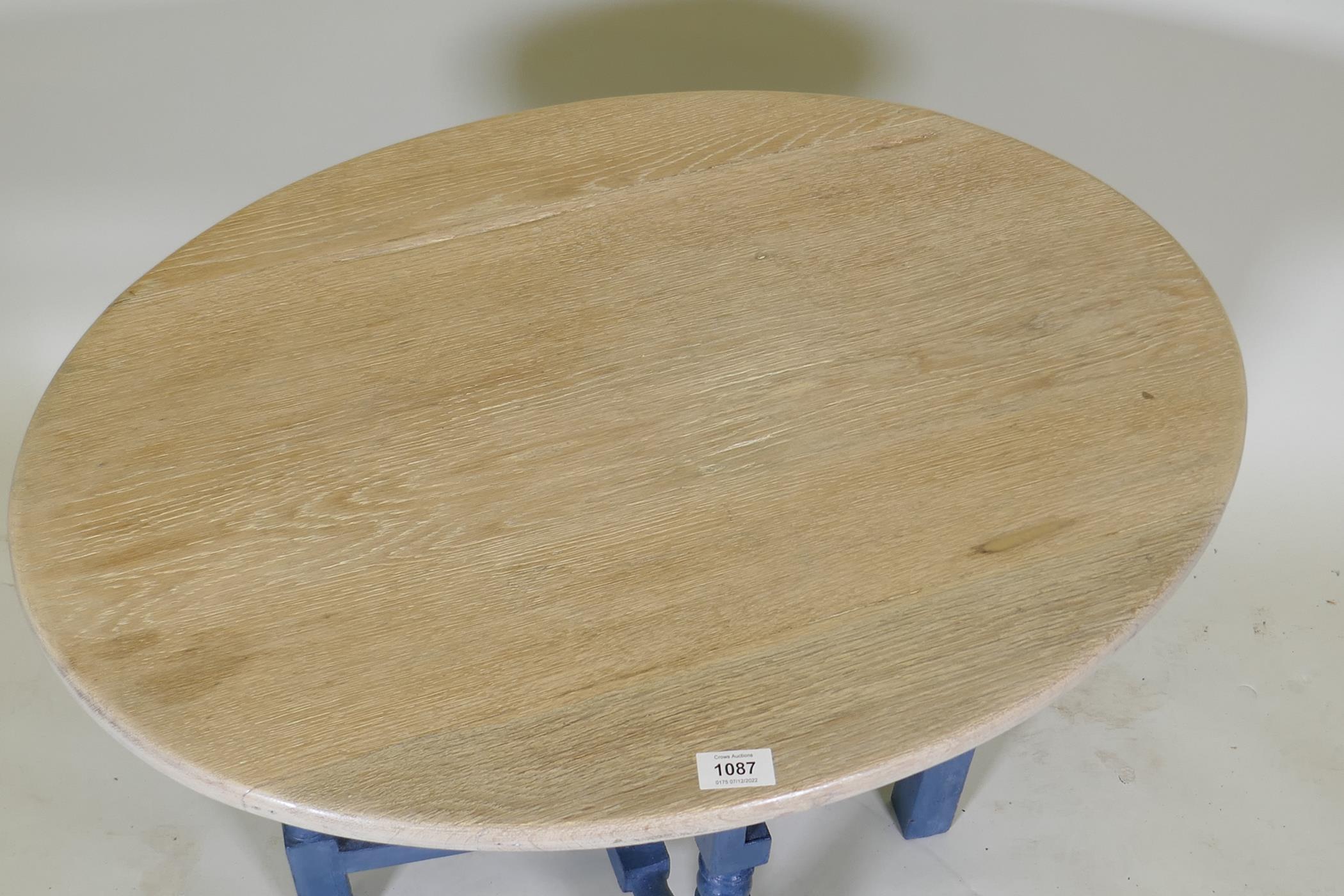 A painted oak folding table with oval limed top, 74 x 55cm, 56cm high - Image 2 of 5