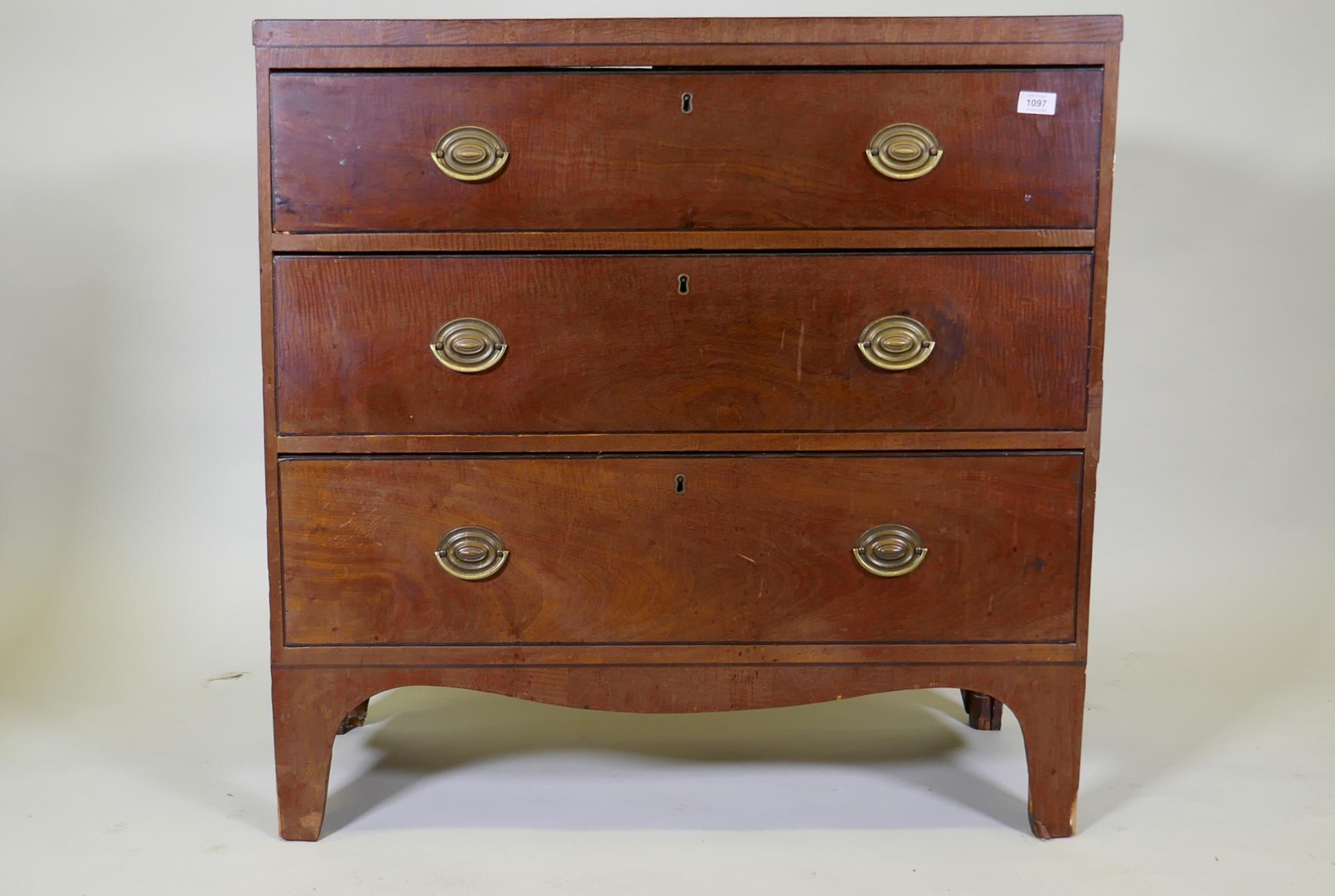 A Regency mahogany chest of three long drawers, caddy top and ebony inlaid decoration, pine