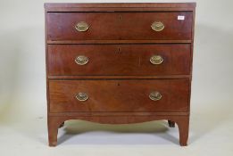 A Regency mahogany chest of three long drawers, caddy top and ebony inlaid decoration, pine