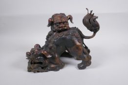 A Chinese gilt bronze censer in the form of two fo dogs, 24cm high