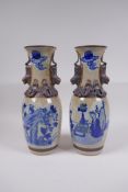 A pair of Chinese blue and white crackleware vases with bronze style bands and handle, and painted