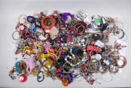 A large quantity of costume jewellery including bangles, necklaces, earrings, pendants etc