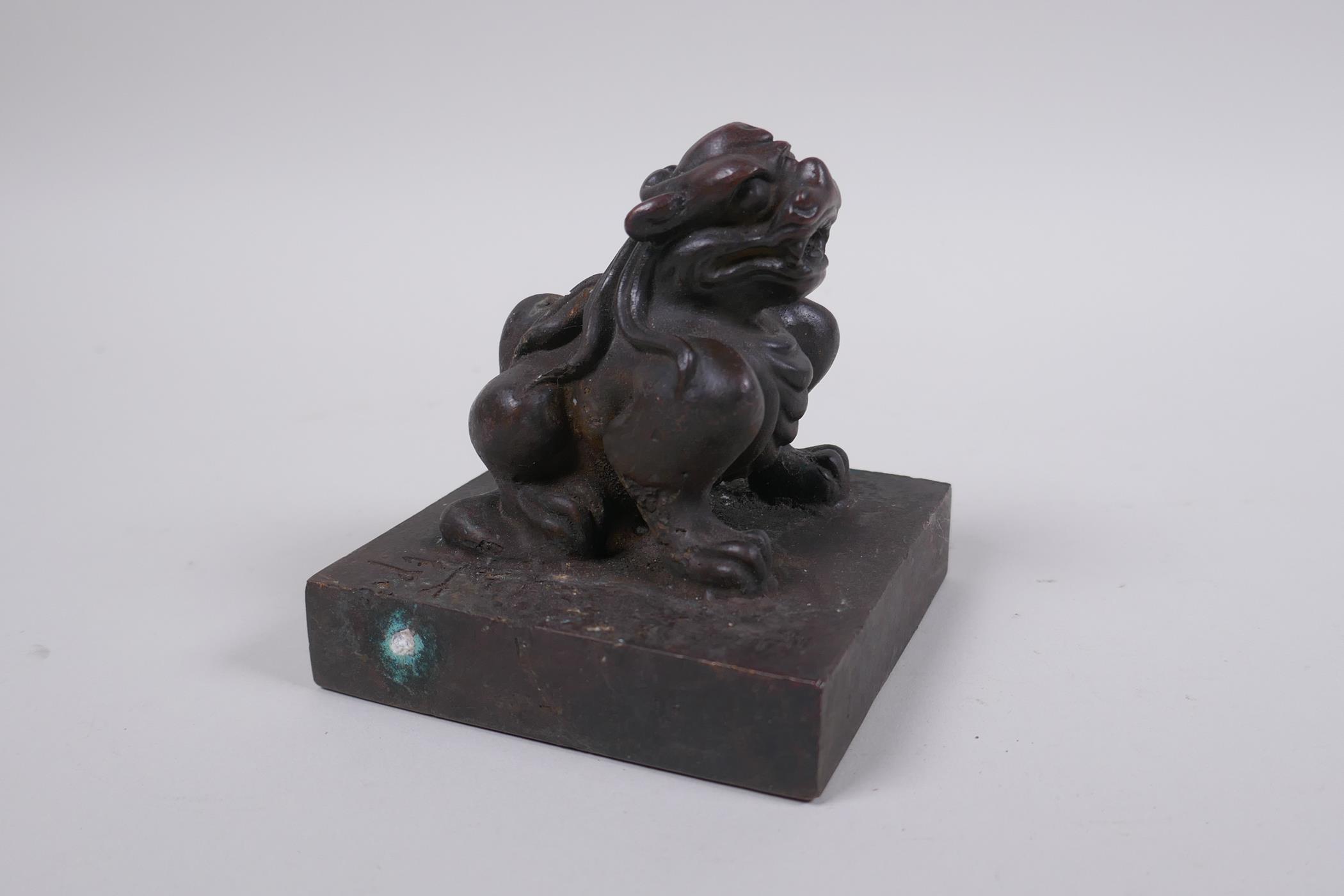 A Chinese bronze seal with a kylin knop, 9 x 9cm - Image 2 of 5