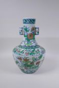 A doucai porcelain vase with two lug handles and lotus flower decoration, Chinese Qianlong seal mark