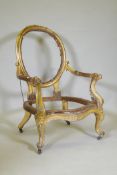 A C19th giltwood spoon back open arm chair with carved crest and scrolled, raised on cabriole