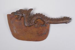 A Sino Tibetan bronze handled ceremonial chopper, the handle in the form of a dragon with the