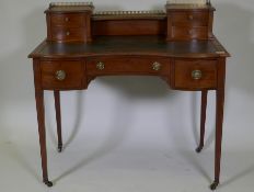 A Victorian inlaid mahogany bonheur de jour, the upper section with pierced brass gallery over