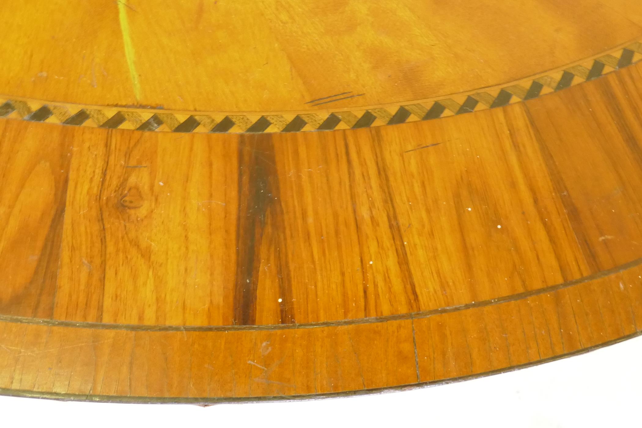 A C19th satinwood occasional table with segmented veneered oval top with laburnum crossbanding, 61 x - Image 3 of 6