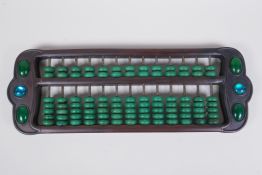 A Chinese hardwood abacus with sea green hardstone beads, 41cm long