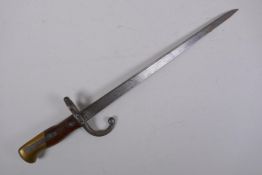 A late C19th French model 1880 short bayonet, manufactured in St Etienne, inscription to the
