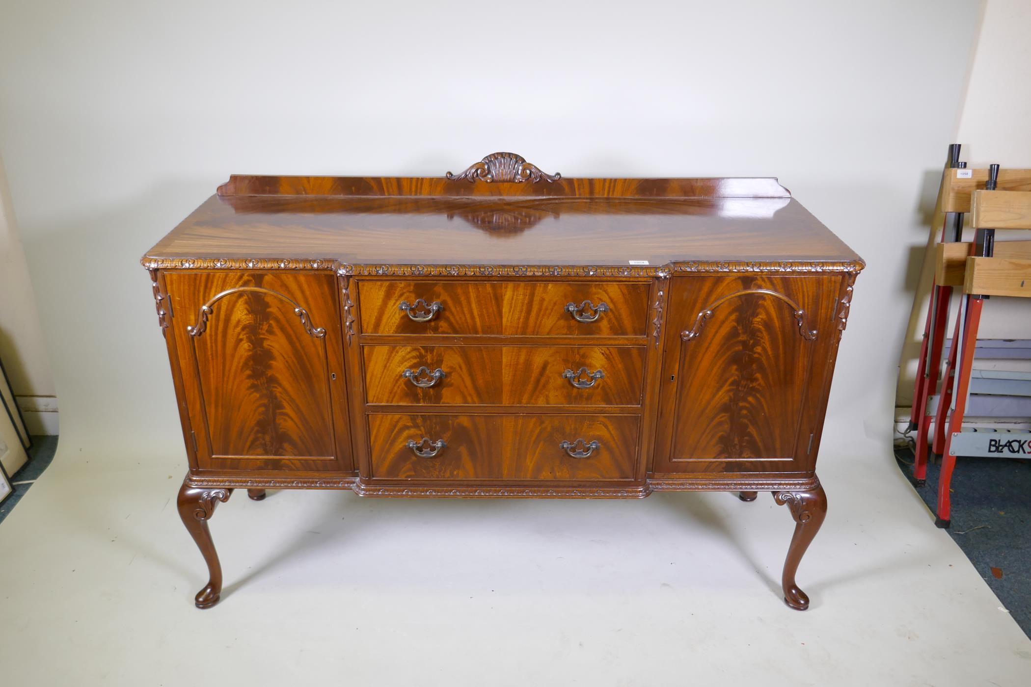 A Maples mahogany breakfront sideboard, with three drawers flanked by two doors, raised on - Image 2 of 4
