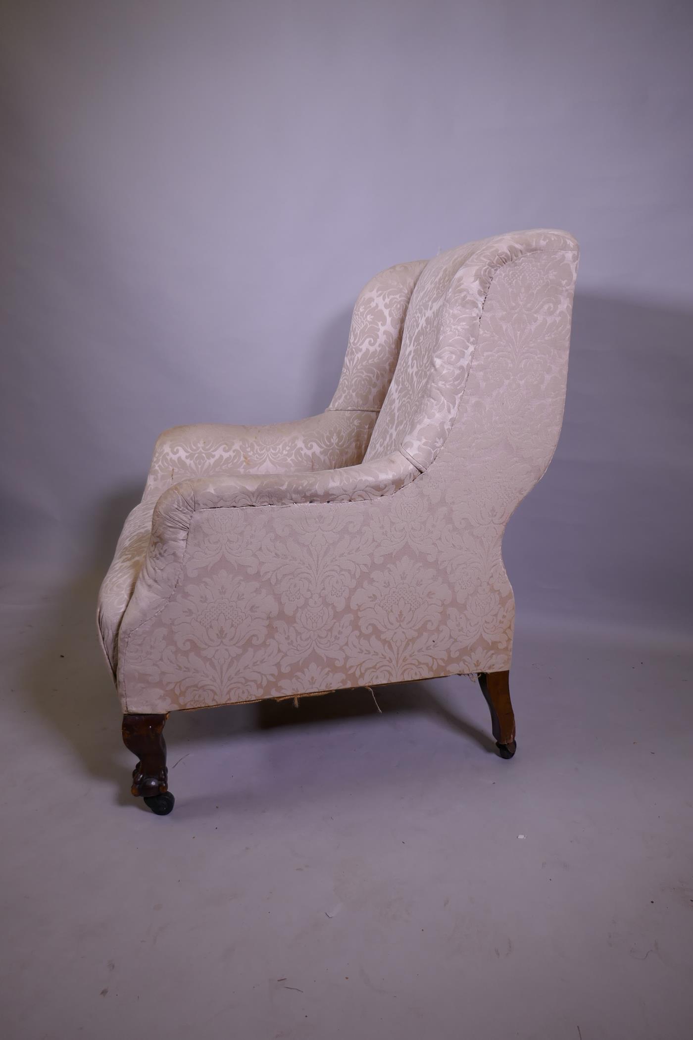 An antique wing armchair with shaped back, raised on cabriole supports with claw and ball feet and - Image 2 of 2