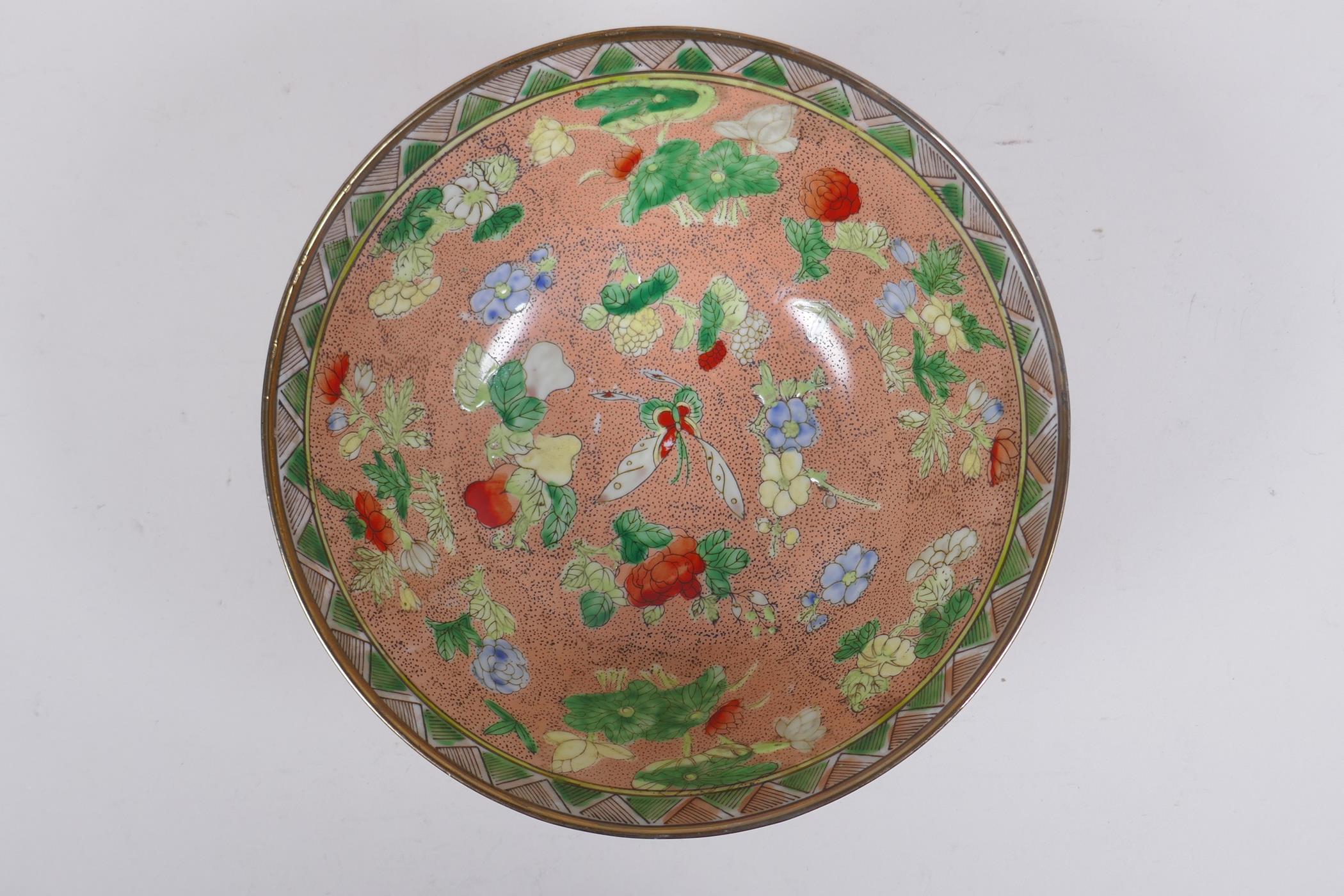 A Chinese peach ground porcelain bowl with famille verte enamel decoration of butterflies, flowers - Image 2 of 6