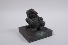 A Chinese bronze seal with a kylin knop, 9 x 9cm