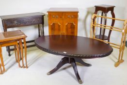 A yew wood media cabinet on bracket feet, an oak two drawer side table, an oval topped mahogany