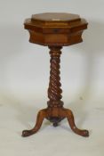 A William IV pollard oak tea poy, the lift up top revealing a fitted interior of a pair of lidded