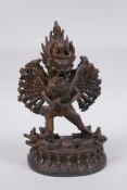 A Tibetan bronze figure of a many armed deity and consort, Chakrasamvara and Vajravahari, double